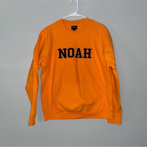 Bold Orange Crewneck Sweater with Striking Chest Design